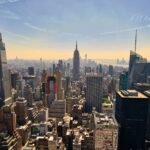 A breathtaking view of New York City's skyline with the Empire State Building in the center, showcasing urban architecture.